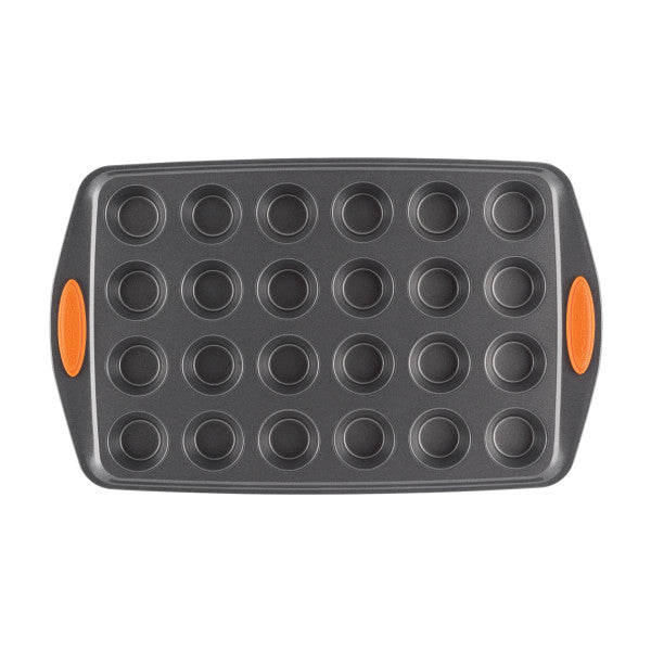 24-Cup Nonstick Mini Muffin Pan featuring orange side grips, designed to be oven safe for all your baking needs.