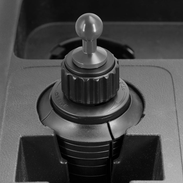 Close-up of a black gear shift lever and textured interior near the Heavy Duty Car Cup Holder Mount (20mm Ball Compatible), shown installed beside a storage compartment.