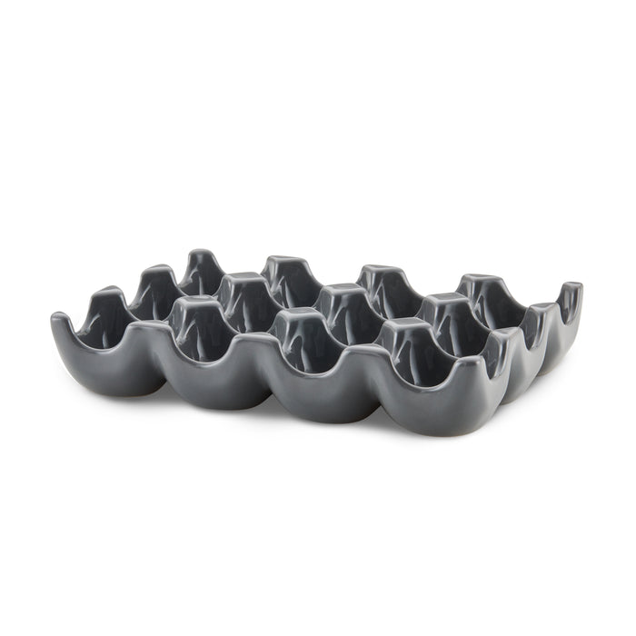 The 12-Cup Ceramic Egg Tray in modern gray is ideal for holding a dozen eggs or serving as a versatile hors d'oeuvres tray.