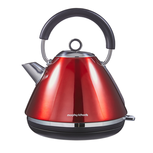 Red electric kettle with black handle on a white background