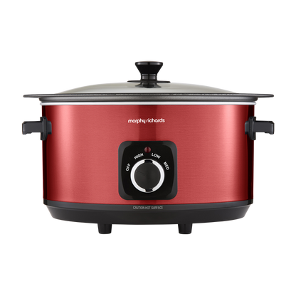 Red slow cooker with black control panel on a white background
