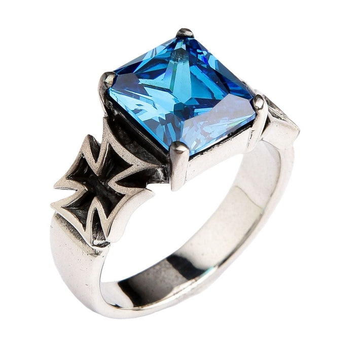 An angled view of the Iron Cross ring, showing the oxidized cross detail and blue stone.