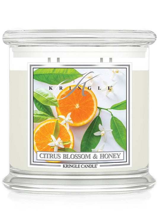 Kringle Candle with Citrus Blossom & Honey label featuring oranges and flowers.