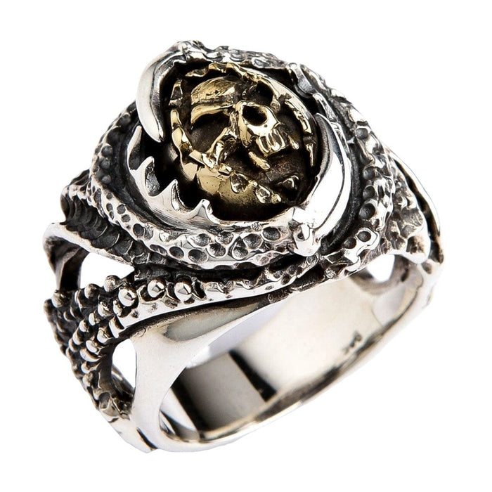 An angled view of the heavy silver biker ring, highlighting the monster claw design and gold-colored skull.