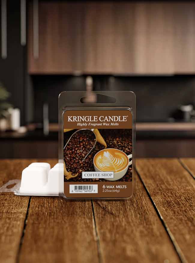 Kringle Candle Coffee Bean wax melt packaging on a wooden surface with a blurred kitchen background