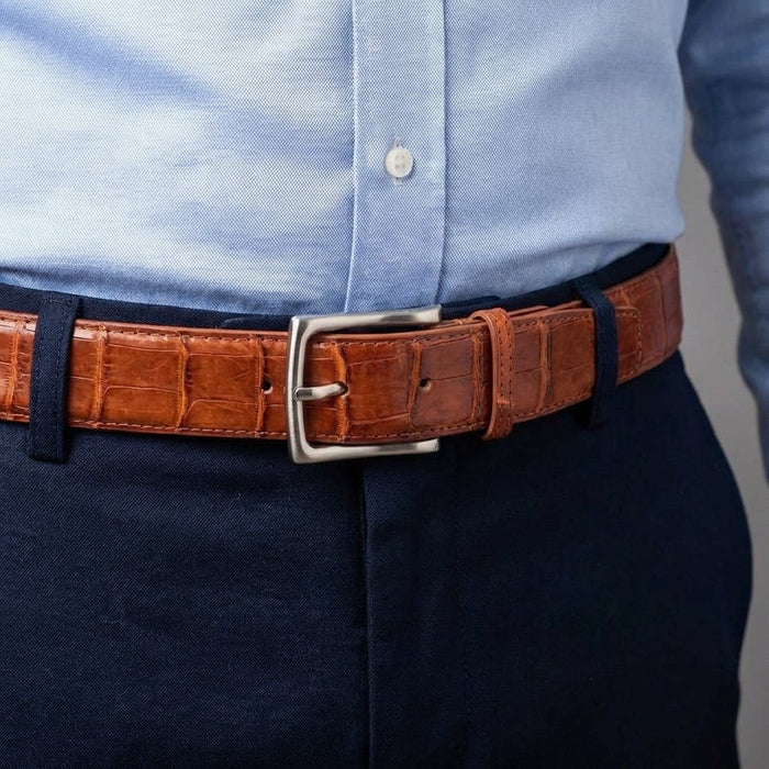 Crocodile belt styled with navy pants and light blue shirt for business casual look