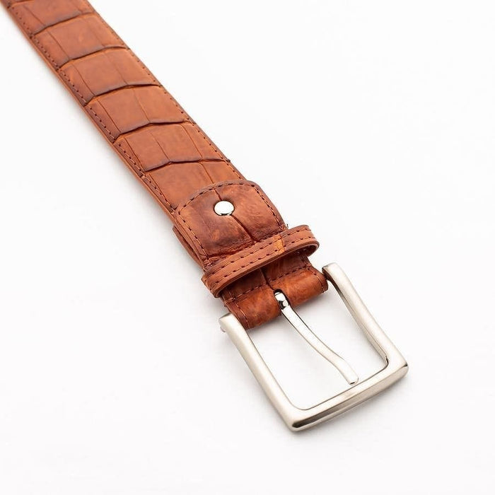 Genuine crocodile belt keeper and buckle detail in cognac brown leather