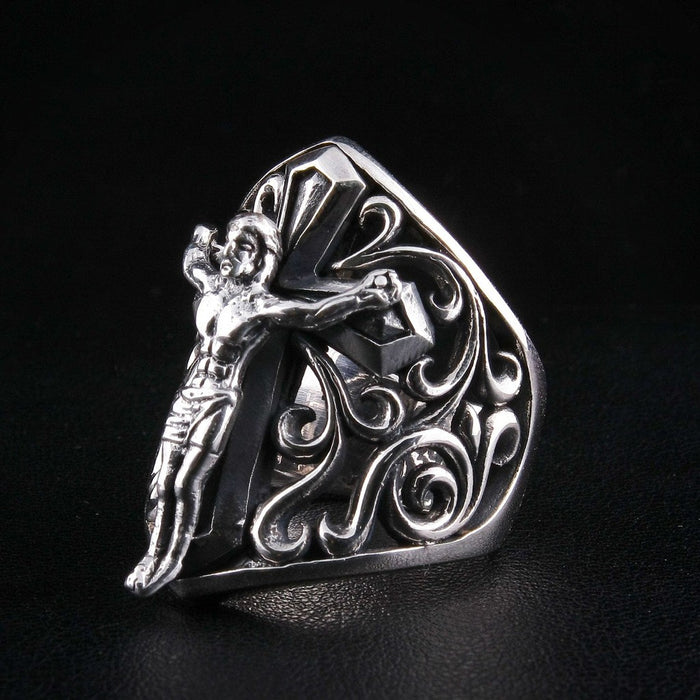 Right side view highlighting filigree scrollwork on sterling silver crucifix ring