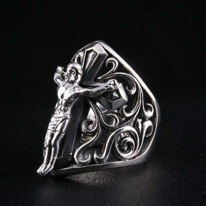 Right side view highlighting filigree scrollwork on sterling silver crucifix ring
