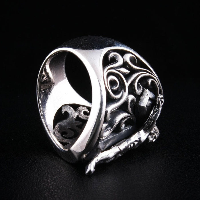 Bottom view of crucifix shield ring showing openwork design and band construction