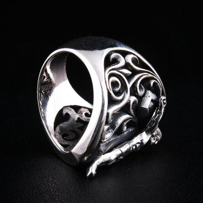 Bottom view of crucifix shield ring showing openwork design and band construction