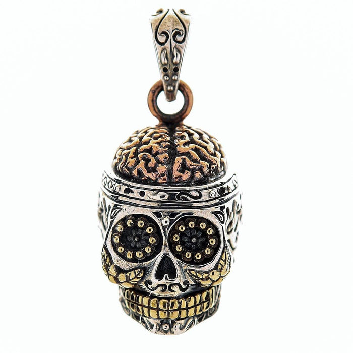 A multi-metal Day of the Dead skull pendant in sterling silver, with a detailed copper brain and warm brass teeth.