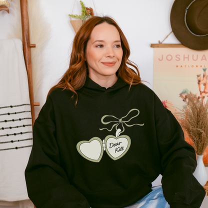 Dear Kitt Heart Locket Hoodie | Divine Rivals Rebecca Ross Gift - The Bean Workshop - Bookish Hoodie, Bookworm Gift, Cottagecore Aesthetic, Dear Kitt apparel, Divine Rivals hoodie, Fantasy Reader, hoodie, Iris and Roman gift, Iris Winnow, Letters of Enchantment, Letters of Enchantment hooded sweatshirt, Literary Streetwear, Rebecca Ross, Rebecca Ross fan merchandise, Romantic Book Merch, Vintage Locket