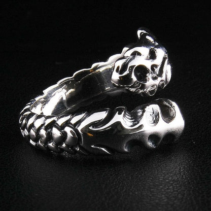 A gothic-style dragon blade ring, handcrafted from polished and oxidized sterling silver.