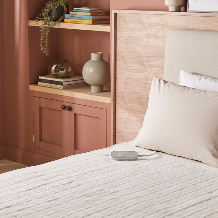 electric heated underblanket on bed