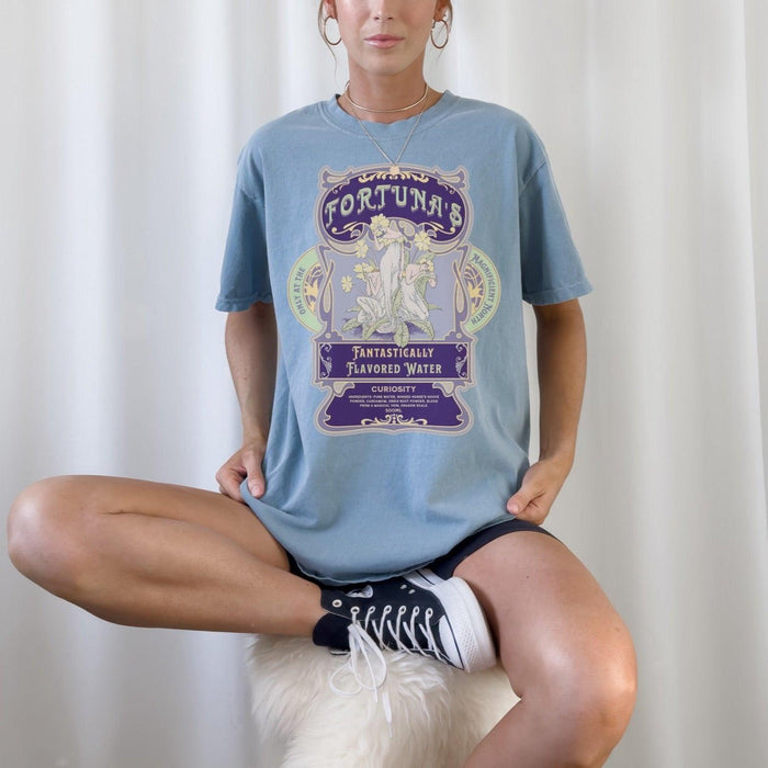Fortuna's Fantastically Flavored Water T-Shirt - The Bean Workshop - Botanical illustration, evangeline fox, Fortuna's shop t-shirt, Jacks and Evangeline, jacks prince of hearts, Magnificent North souvenir, once upon a broken heart, ouabh, Purple Aesthetic, stephanie garber, t-shirt, Vintage Label, whimsical fantasy book tee