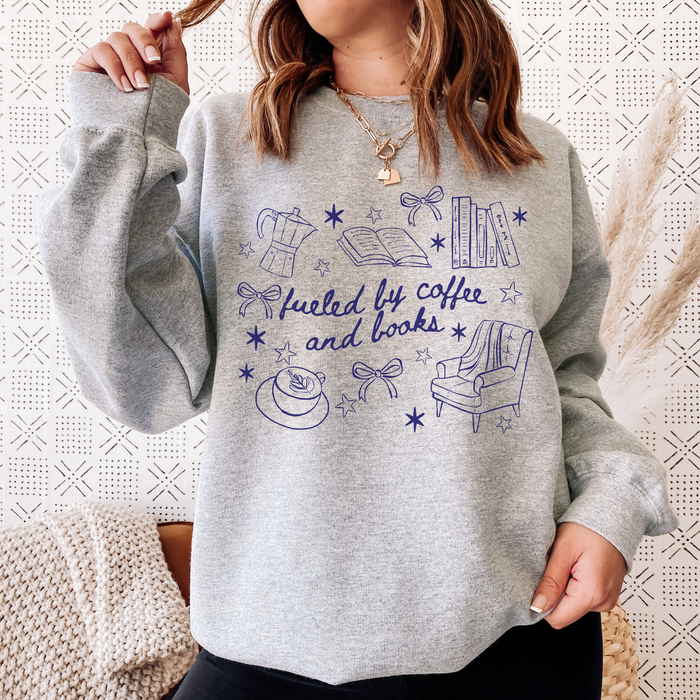 Fueled by Coffee and Books Sweatshirt - The Bean Workshop - Bookaholic, Bookish Sweatshirt, Bows, Coffee Lover Gift, Coquette Aesthetic, Cozy Reading, Cozy Valentine's Gift for Bookworm, Doodle Art, Fueled by Coffee and Books Sweatshirt, Loungewear, Reader Gift, Reading Crewneck, sweatshirt, Winter Wear