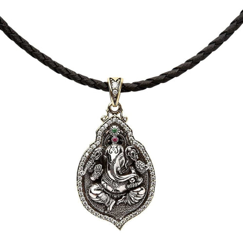 The Ganesh silver pendant attached to a black braided leather cord necklace.