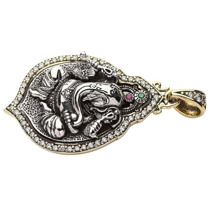 Side profile of the pendant showing the thickness and the gold plating on the bail.