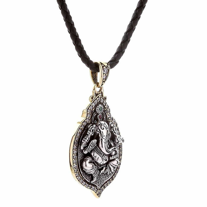 The Ganesh pendant hanging freely on its leather cord, showing the two-tone design.