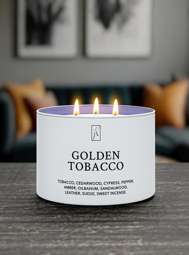 Candle labeled 'Golden Tobacco' with flames on a blurred background
