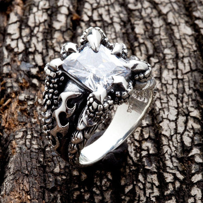 Side detail of gothic ring showing scaled texture and oxidized finish