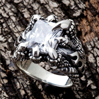 Top angle view of heavy silver biker ring with claw setting