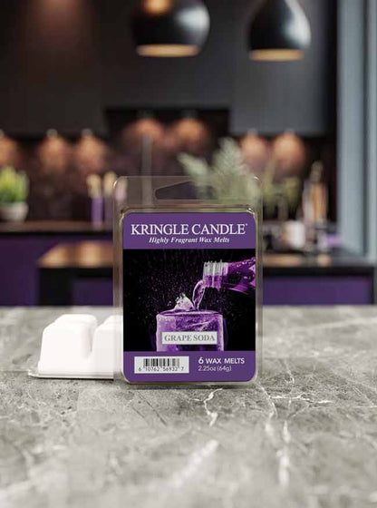 Kringle Candle wax melt package on a marble surface with a blurred background