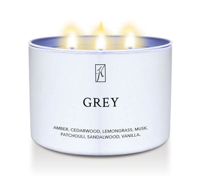 Candle in a white container labeled 'GREY' with a logo, on a white background