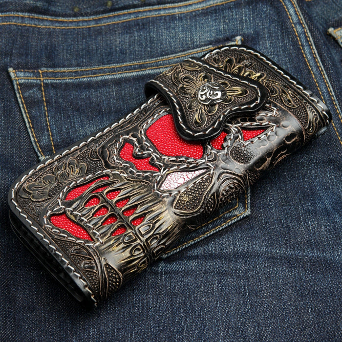 Angled view of gothic leather wallet showing sterling silver flame snap and deep carving