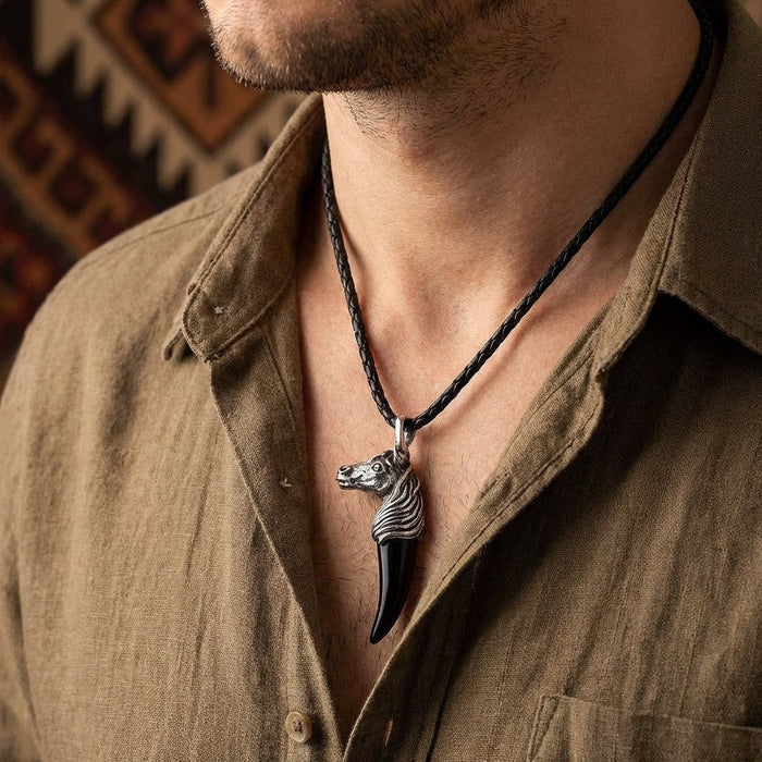 Men's sterling silver horse necklace with black onyx fang pendant worn on model