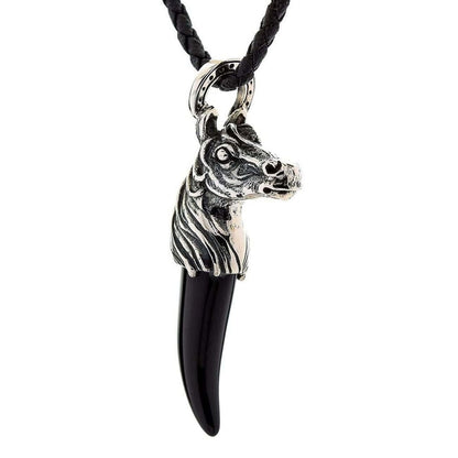 Equestrian sterling silver pendant featuring detailed horse head and black onyx fang angled view