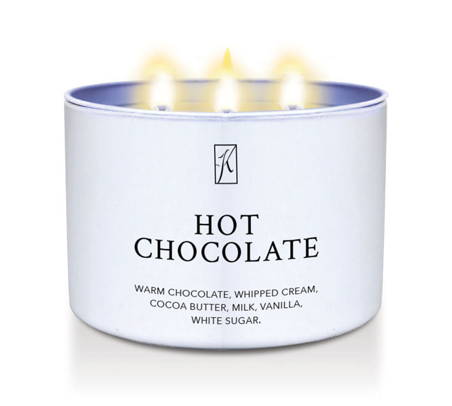 Candle in a white container labeled 'Hot Chocolate' with flames on a white background