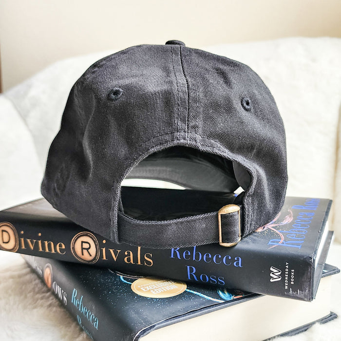 Inkridden Tribune Press War Correspondent Embroidered Bio-Washed Dad Hat - The Bean Workshop - cozy gift, Divine Rivals, divine rivals embroidered hat, hat, Inkridden Tribune, Inkridden Tribune apparel for readers, inkridden tribune press hat for readers, Rebecca Ross, Rebecca Ross book merch, Rebecca Ross fan merchandise