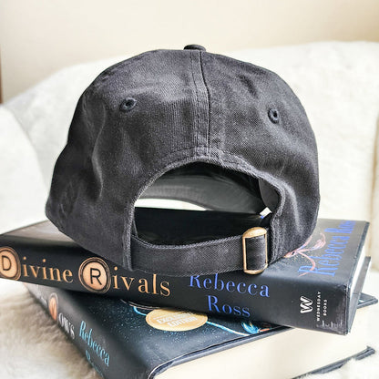 Inkridden Tribune Press War Correspondent Embroidered Bio-Washed Dad Hat - The Bean Workshop - cozy gift, Divine Rivals, divine rivals embroidered hat, hat, Inkridden Tribune, Inkridden Tribune apparel for readers, inkridden tribune press hat for readers, Rebecca Ross, Rebecca Ross book merch, Rebecca Ross fan merchandise