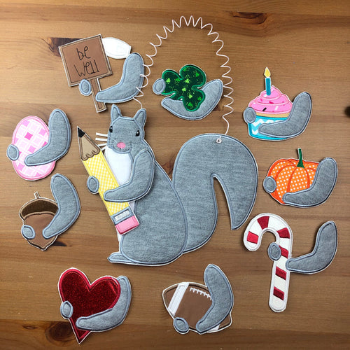 In the hoop Squirrel Door hanger with interchangeable accessories for use with an embroidery machine by www.snugglepuppyapplique.com