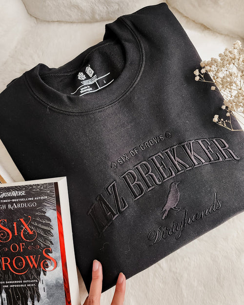 Kaz Brekker Embroidered Sweatshirt - The Bean Workshop - Bookish Gift, Bookworm Apparel, Crow Club, Dark Fantasy, Dirtyhands, Grishaverse sweatshirt, Kaz Brekker embroidered sweatshirt, Ketterdam, Leigh Bardugo fan apparel for readers, Literary Character, Minimalist Aesthetic, Six of Crows minimalist merch, The Dregs