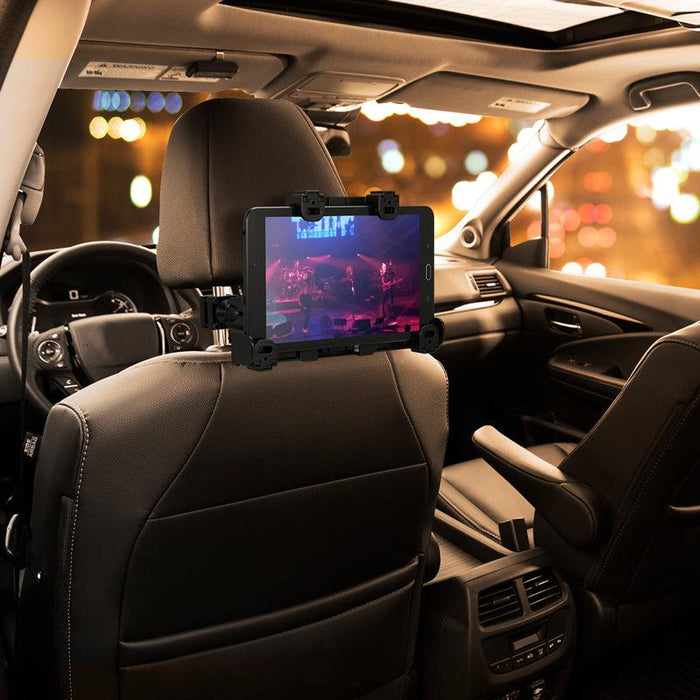 The LockVise™ Locking Car Headrest Tablet Mount secures your tablet to the back of a car seat, turning it into an immersive entertainment system—perfect for watching videos against a backdrop of city lights.
