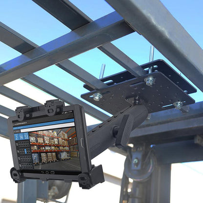 A tablet is attached to the overhead frame using the LockVise™ Locking Forklift Overhead Guard Tablet Mount with 8.5 Metal Shaft, displaying a warehouse inventory management screen with shelves and item listings.