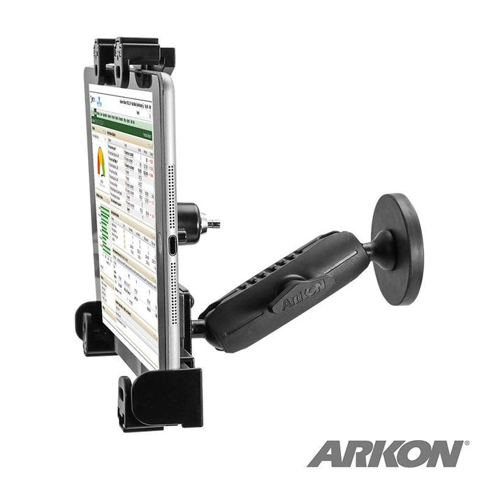 A black LockVise™ Locking Magnetic Tablet Mount with an adjustable arm securely holds a tablet showing a data sheet. The secure mount features the Arkon logo in the bottom right corner.