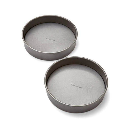 Two gray cake pans on a white background