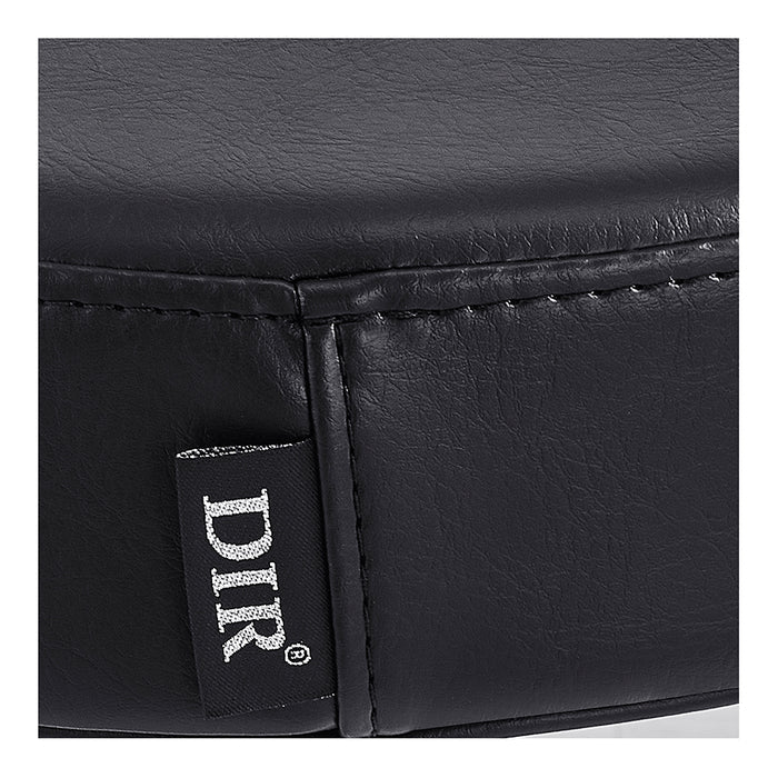 Close-up of Panda Pedi Stool Black DIR's faux leather cushion with stitched seam and DIR tag.