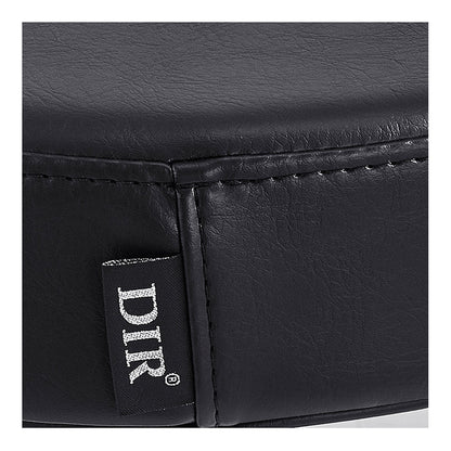 Close-up of Panda Pedi Stool Black DIR's faux leather cushion with stitched seam and DIR tag.