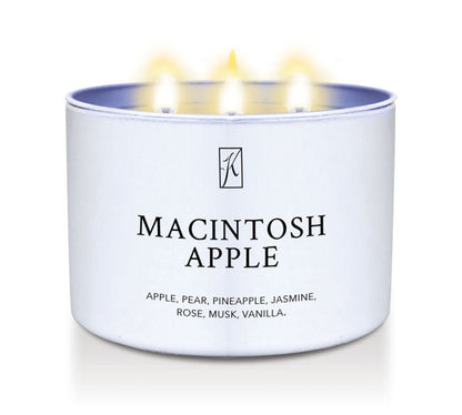 Candle in a white container labeled 'Macintosh Apple' with a logo on a white background