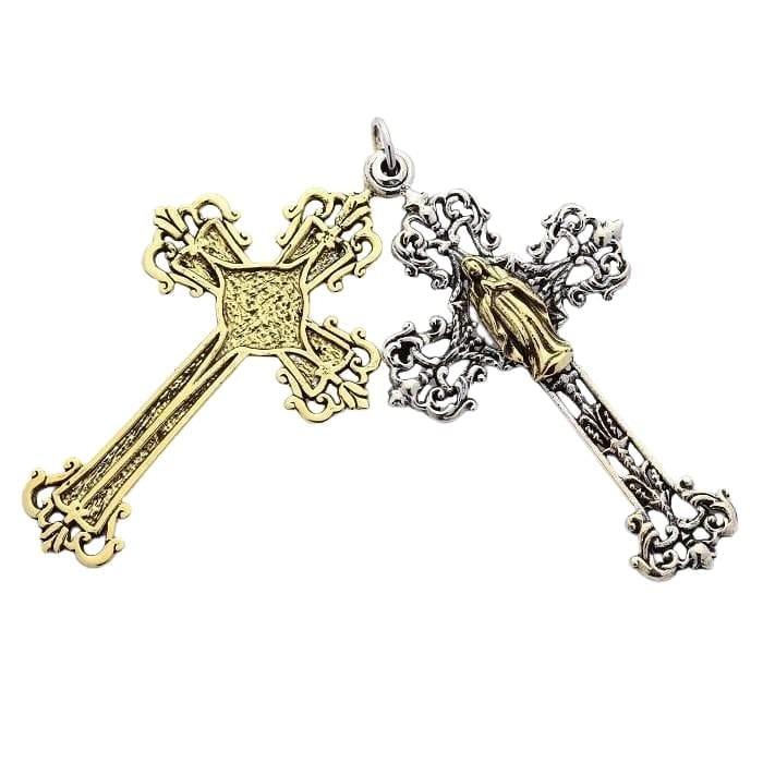 Separated view of the double cross, displaying the textured brass base and ornate silver layer side-by-side.