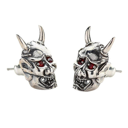 A side profile of the Japanese demon stud earrings, showing the three-dimensional sculpt and sharp horns.