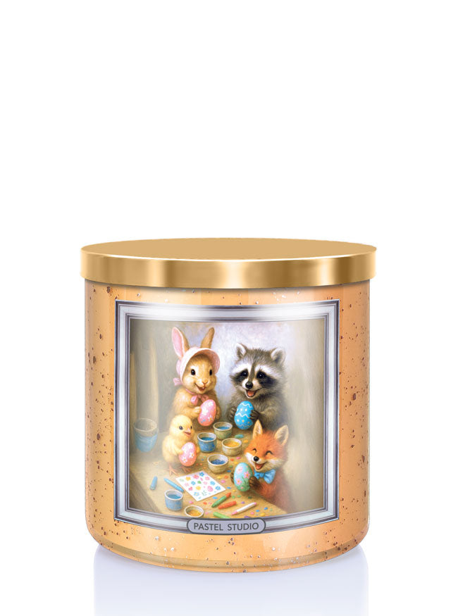 Candle with a design of animals painting Easter eggs on a white background