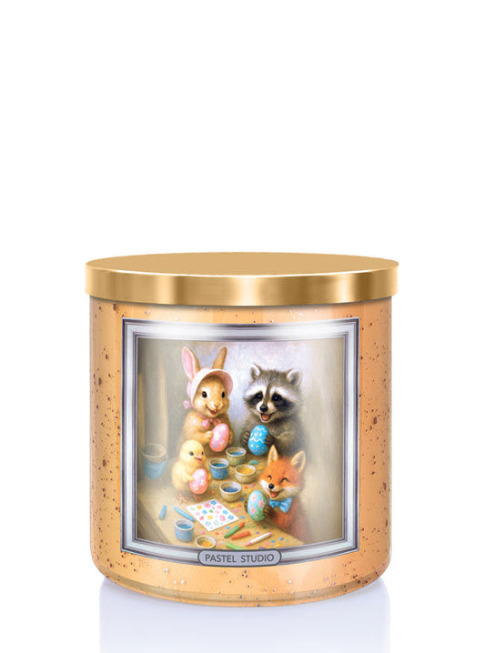 Candle with a design of animals painting Easter eggs on a white background