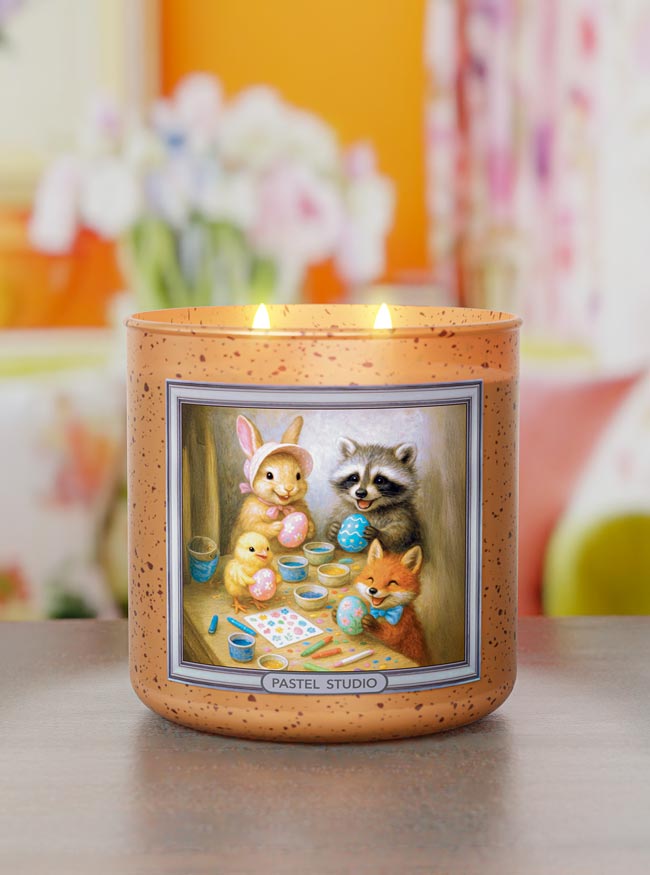 Candle with animal illustration on a blurred background