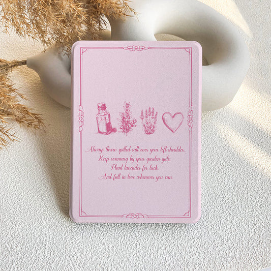 Pink card with illustrations and text on a textured surface